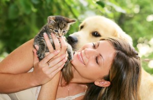 Girl with cat and dog